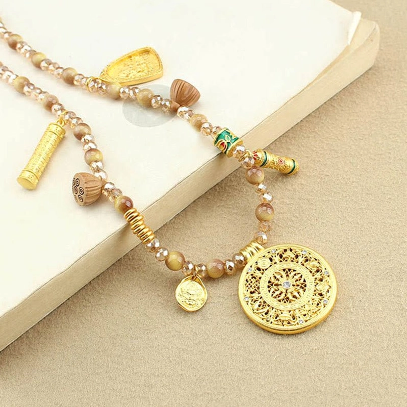 Multi-pendant Tibetan beaded necklace featuring tiger eye stones and gold enamel charms