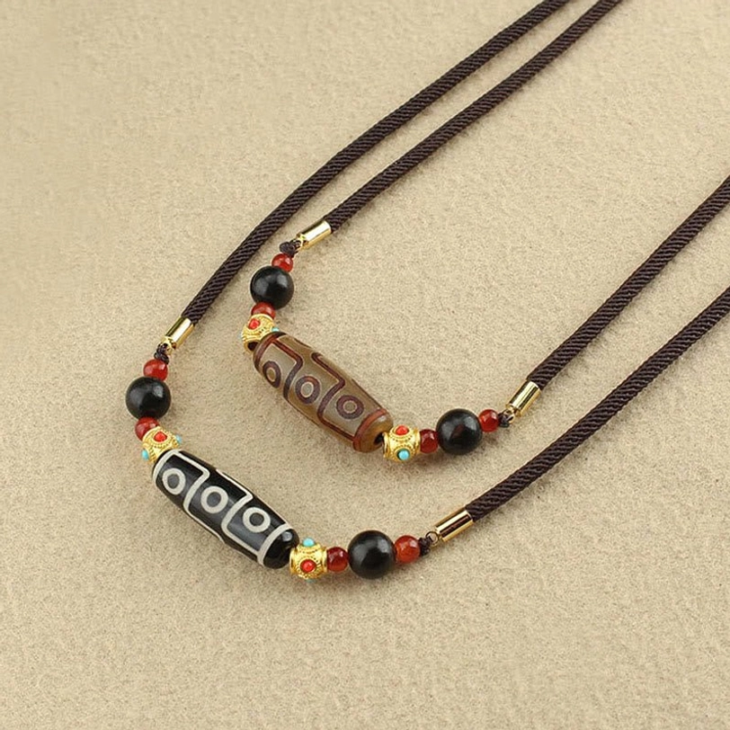 Tibetan nine-eye dzi bead pendant necklace with cosmic protection symbolism