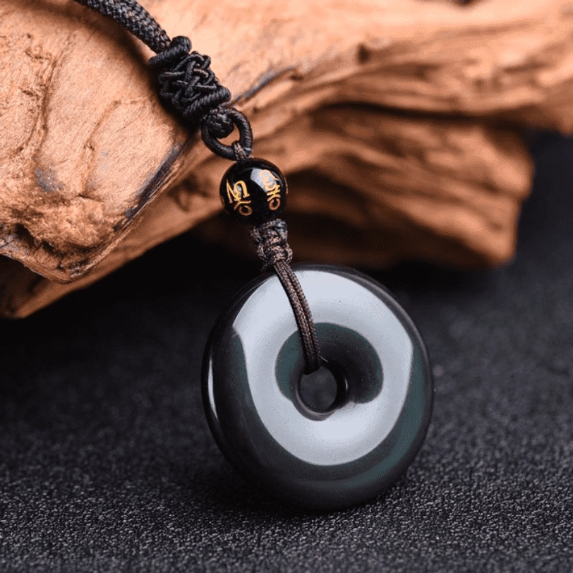Tibetan handcrafted obsidian necklaces close-up detail showing artisan quality, natural stone texture, and braided knots