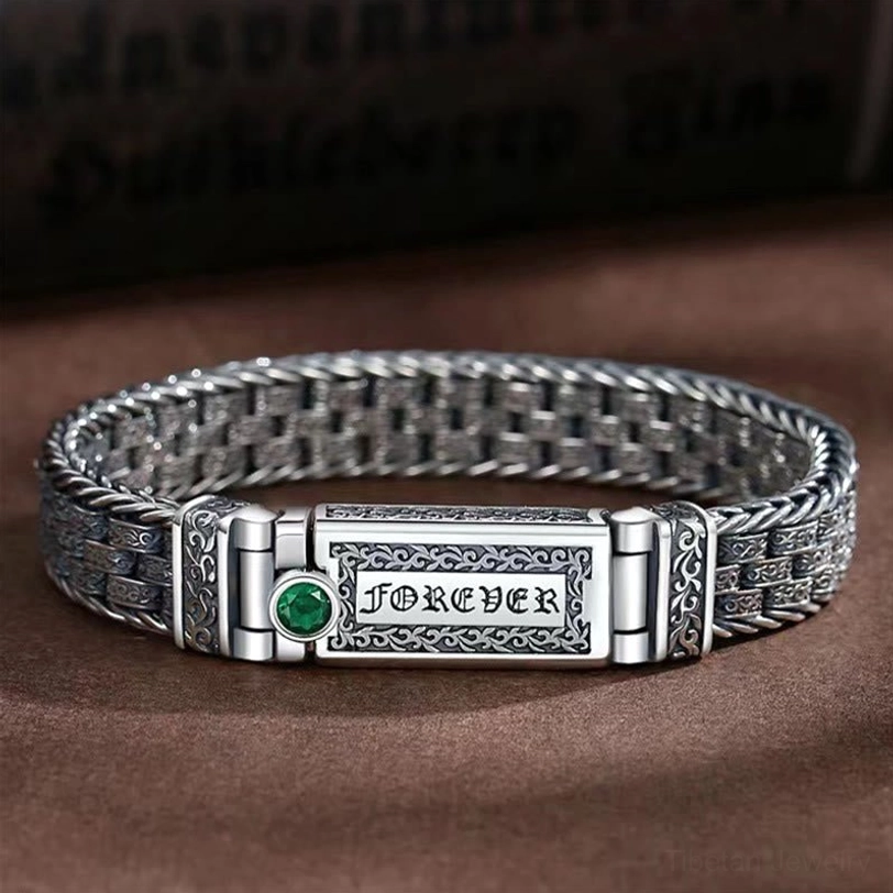 Tibetan Om Mani Padme Hum copper bracelet with Tang Dynasty floral design, front flat lay view showing the complete braided chain and ornamental details