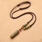 Tibetan Om Mani Padme Hum agate protection necklace pendant with engraved brass cylinder and multi-color gemstone beads