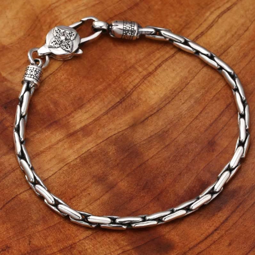 Tibetan om mani padme hum bracelet showing back charm engraving with sacred mantra text