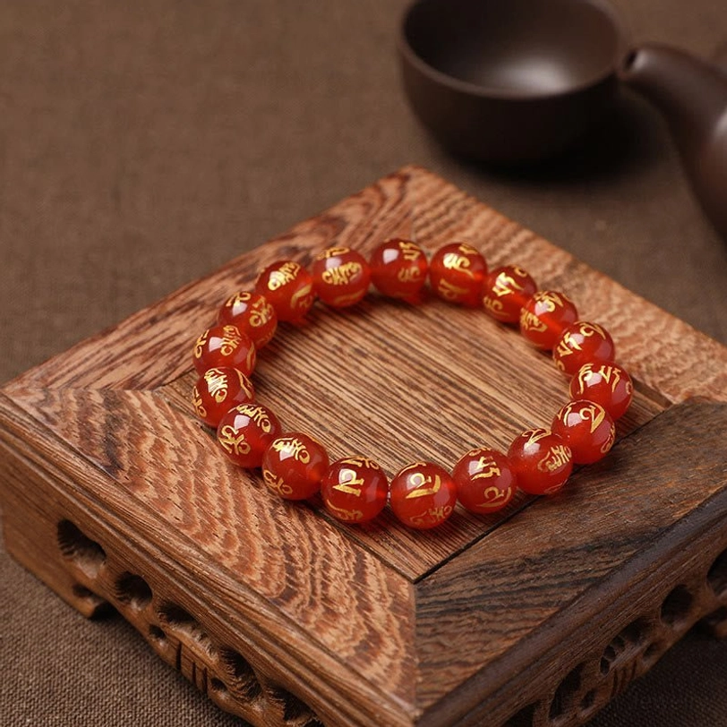 Tibetan om mani padme hum crystal bracelet detail view showing individually hand-engraved bead work