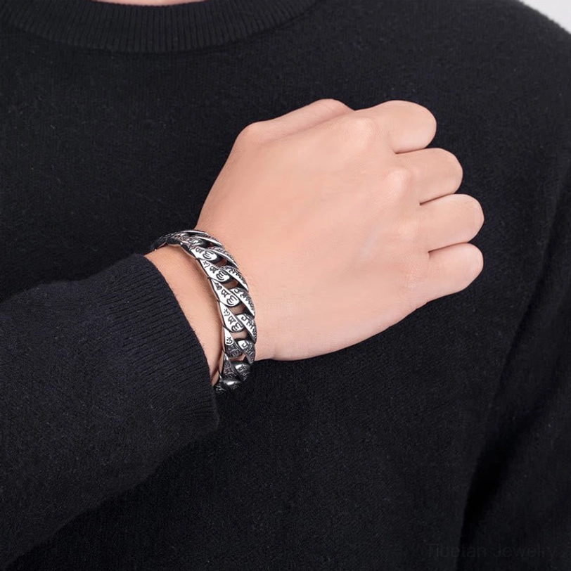 Tibetan Om Mani Padme Hum titanium steel cuff bracelet featuring sacred Buddhist mantra script and open adjustable design