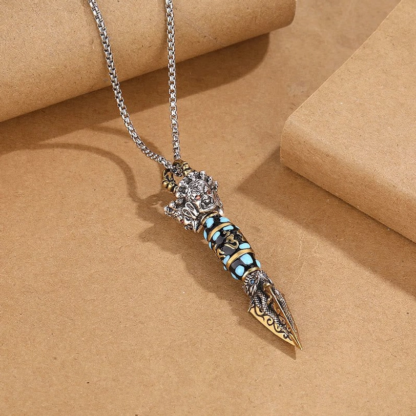 Tibetan Dzi Bead Rotatable Pendant Necklace with Om Mani Padme Hum mantra, side view showing retro Tibetan ritual design elements on kraft background