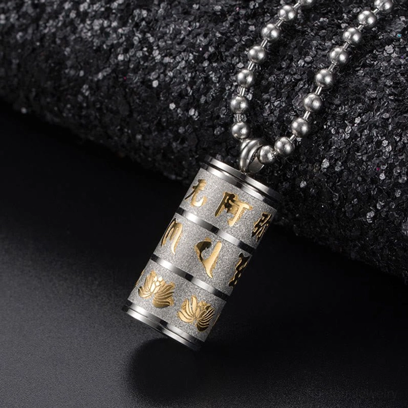 All golden finish Tibetan Om Mani Padme Hum cylinder pendant necklace with engraved sacred motifs