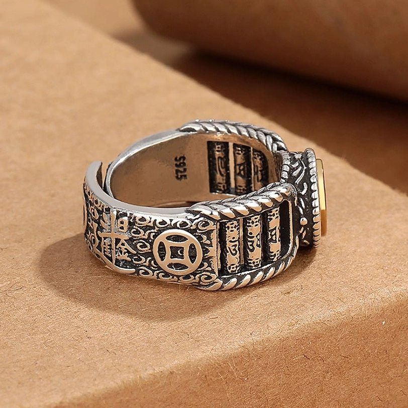 Back view of handmade Tibetan silver engraved ring showing 925 hallmark, intricate sutra patterns, and gold accent details on copper band