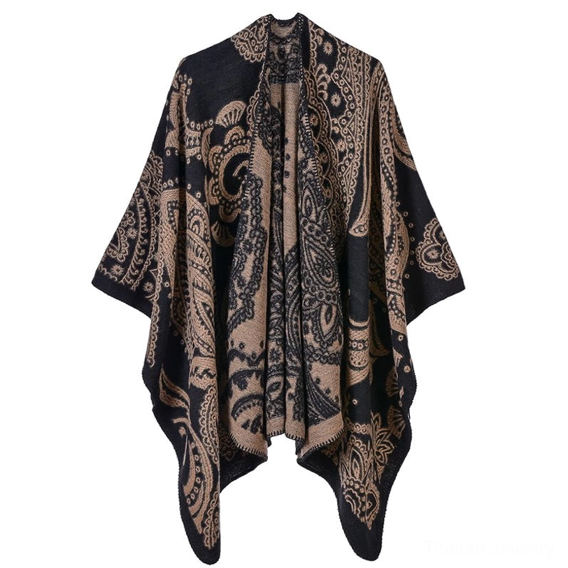 Tibetan paisley poncho flat lay front view, black and taupe paisley pattern, showcasing soft knit fabric texture