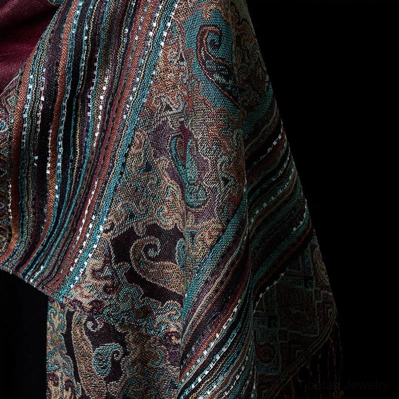 Tibetan handwoven paisley tassel shawl full view showcasing geometric stripe patterns, teal and red color combination, and traditional artistic heritage