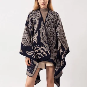 Tibetan paisley poncho shawl in burly wood tone, front full view on model showing oversized fit with navy and taupe jacquard pattern