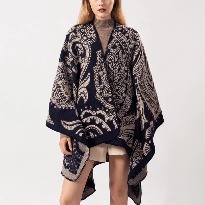 Tibetan paisley poncho shawl in burly wood tone, front full view on model showing oversized fit with navy and taupe jacquard pattern