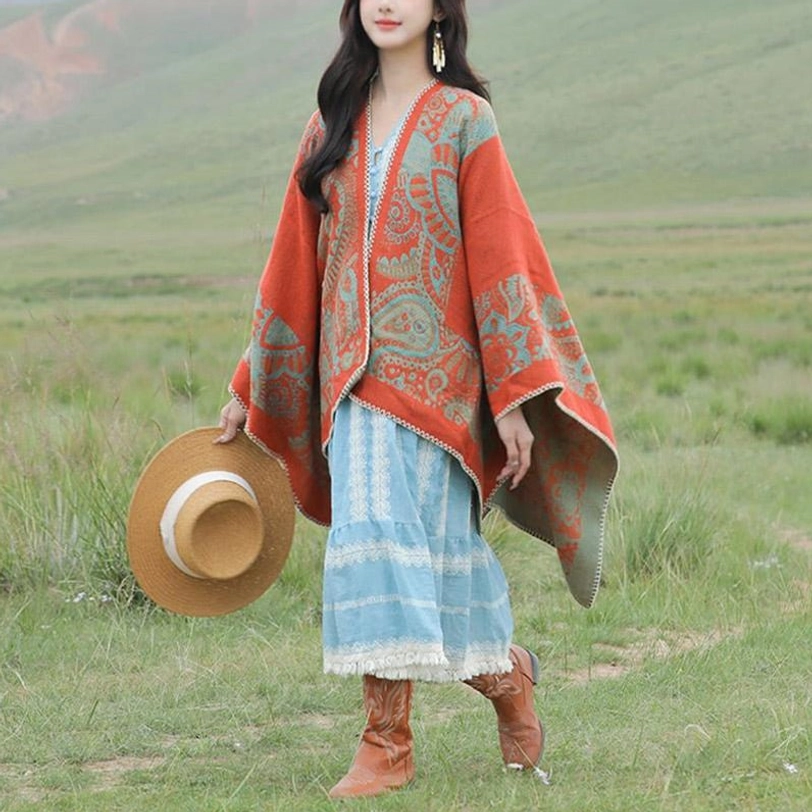 Tibetan paisley poncho jacquard weave pattern close-up showcasing traditional Buddhist motif symbolism