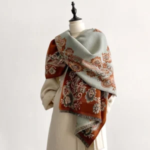 Tibetan reversible paisley scarf with brown and sage green dual-tone floral motifs, displayed on dress form showing three-quarter drape styling