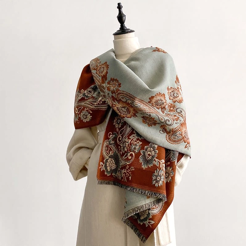 Tibetan reversible paisley scarf with brown and sage green dual-tone floral motifs, displayed on dress form showing three-quarter drape styling
