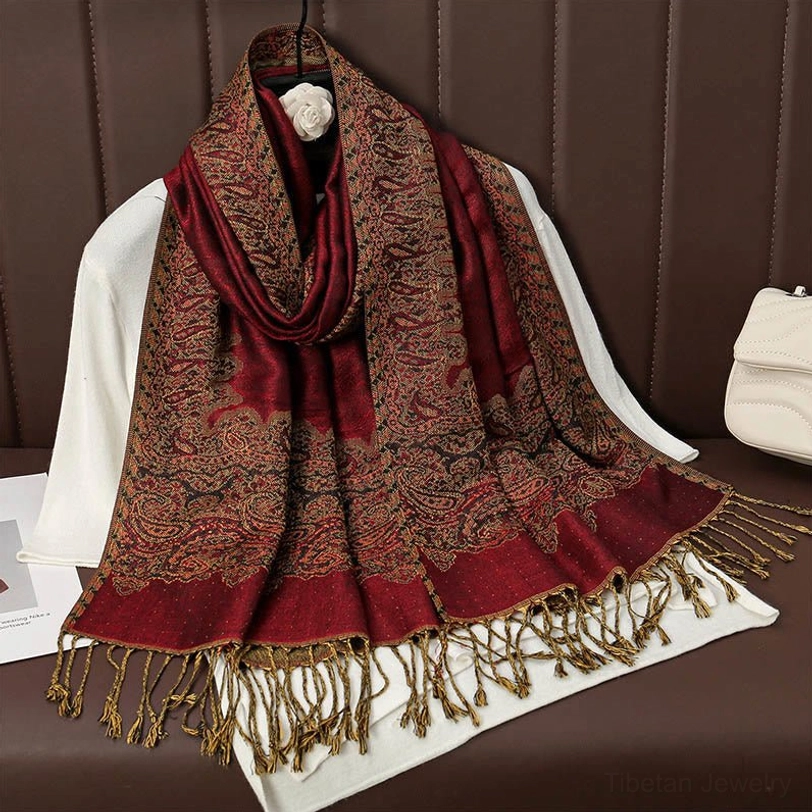 Burgundy red and brown classic paisley jacquard tassel scarf hanging showing all-over paisley pattern and matching tassels