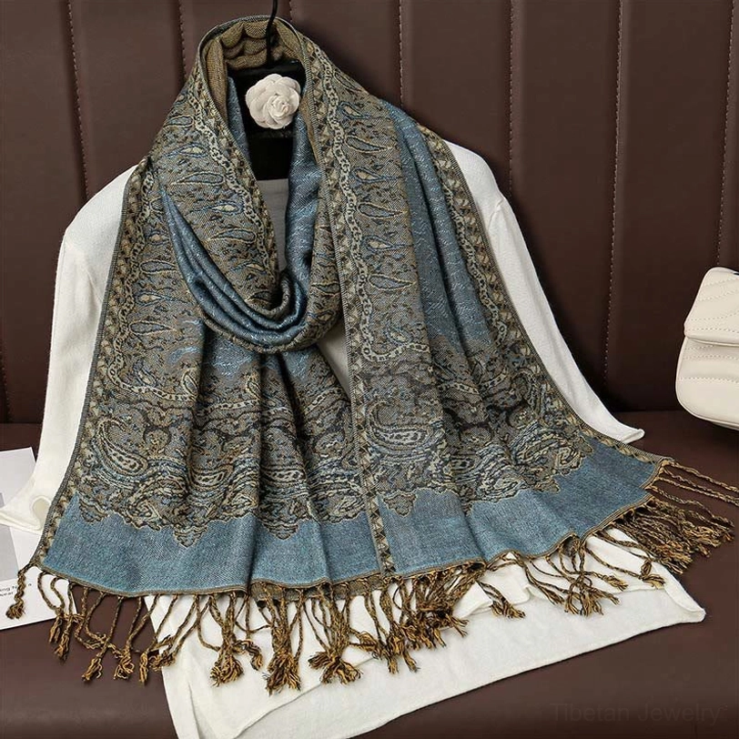 Dusty blue and grey neutral tone paisley tassel scarf with delicate paisley prints and brown tassel edge detail