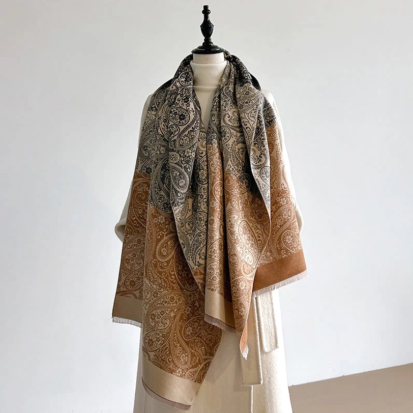 Tibetan handwoven paisley scarf on dress form featuring grey-tan-brown soft woven fabric with ethnic vine motif