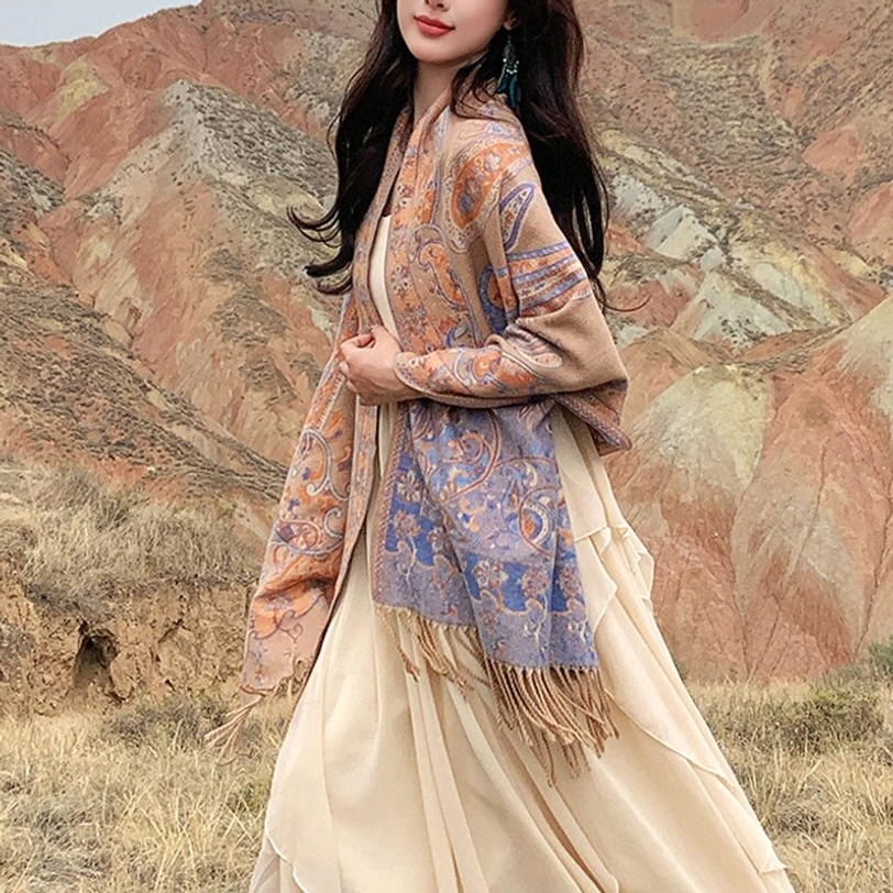 Beige Tibetan paisley tassel shawl displayed showing soft cream tone with intricate paisley motif