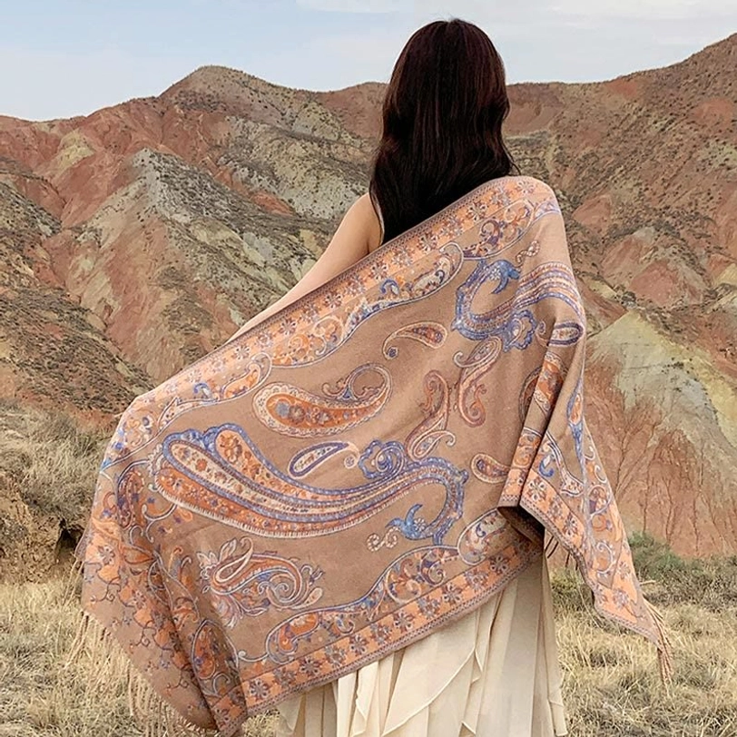 Beige Tibetan tassel shawl detail view showing soft weave quality and paisley pattern in light neutral tones