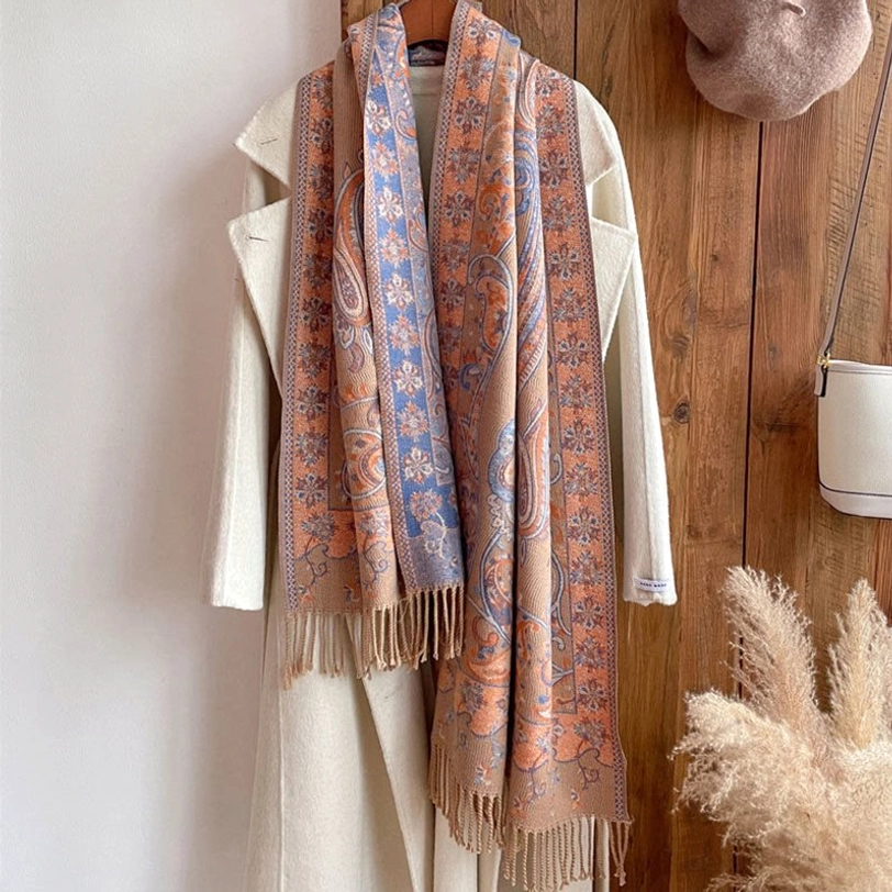 Beige Tibetan tassel shawl worn wrapped on model showing comfortable fit and neutral elegant styling
