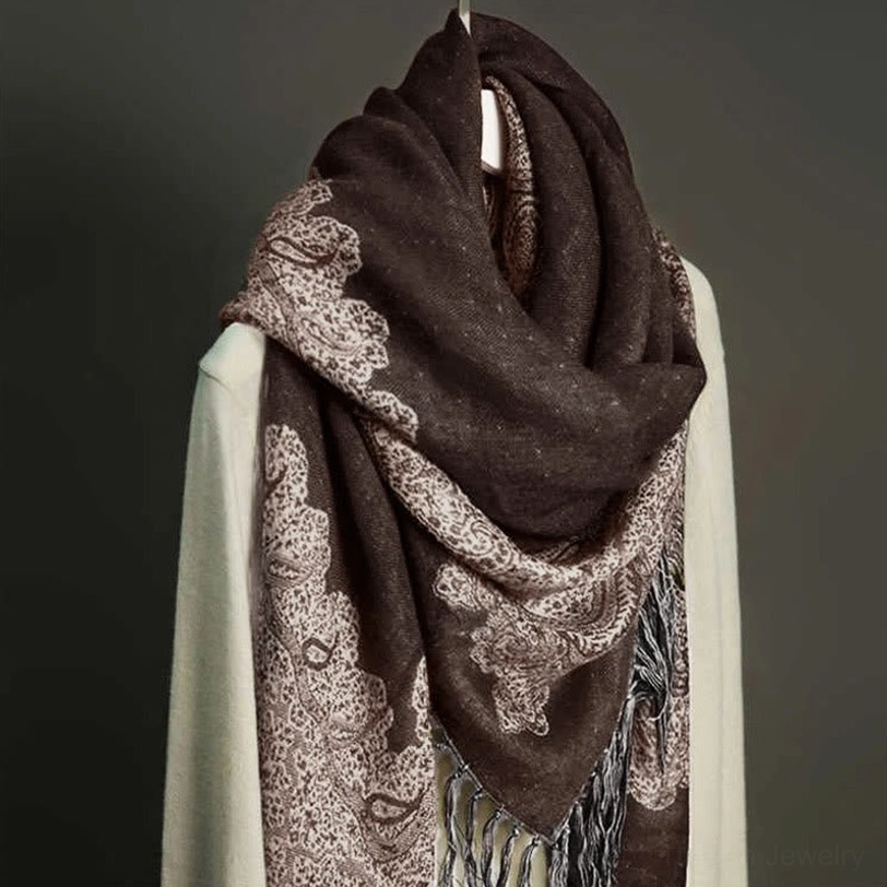 Dark brown and beige bordered paisley tassel shawl three-quarter view draped showing side tassels and paisley motifs