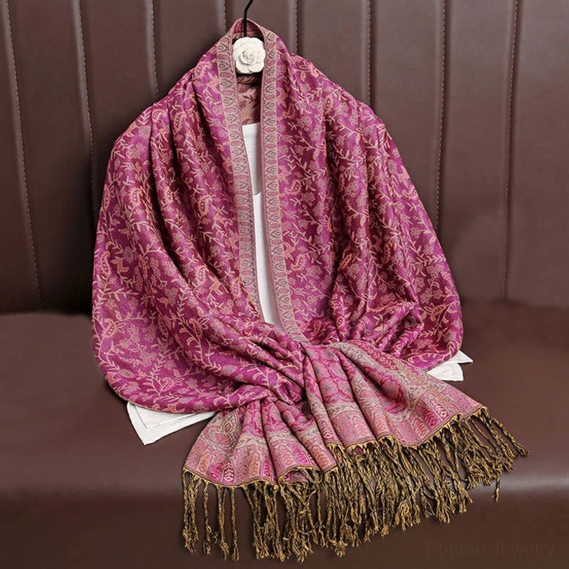 Tibetan paisley shawl color detail highlighting rich jewel tone dyes and color contrast design characteristic of handwoven textile artistry