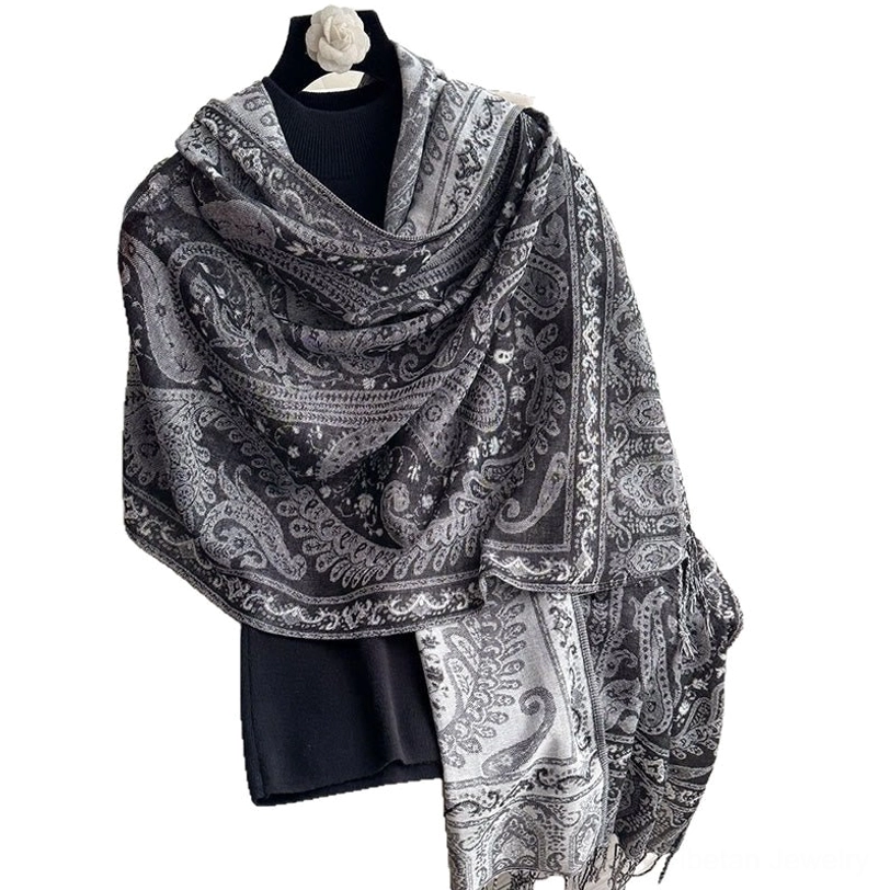 Multiple color variants of Tibetan paisley shawls displayed together showing variety