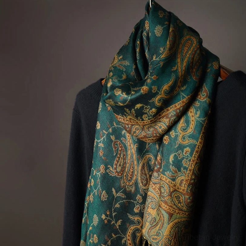 Full paisley patterned tibetan shawl on mannequin displaying complete design and neatly trimmed edge borders