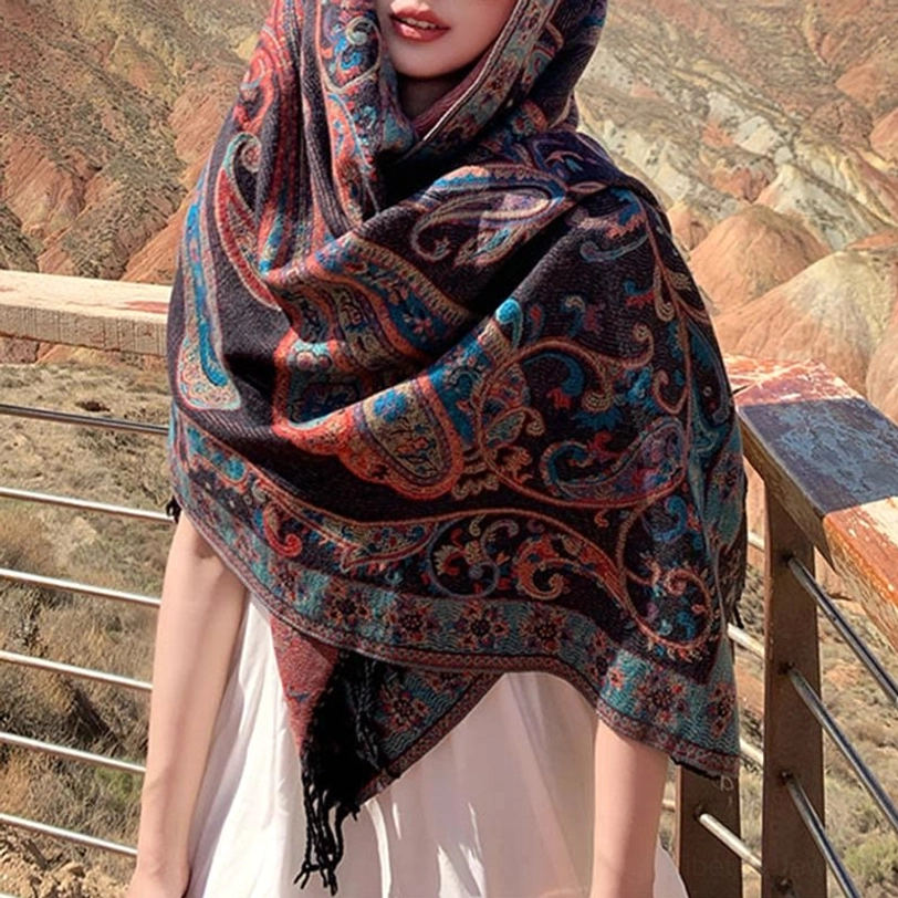 Dark Magenta Tibetan tassel shawl on model showing luxurious drape and jewel-tone paisley motif richness