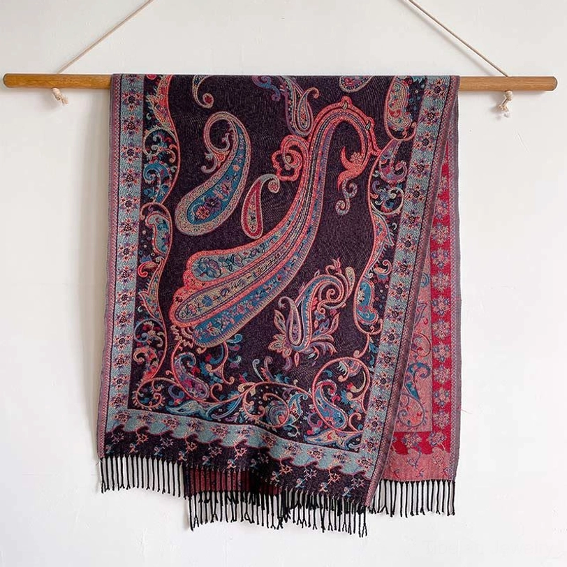 Dark purple Tibetan paisley tassel shawl with pink and blue print pattern, displayed on white backdrop
