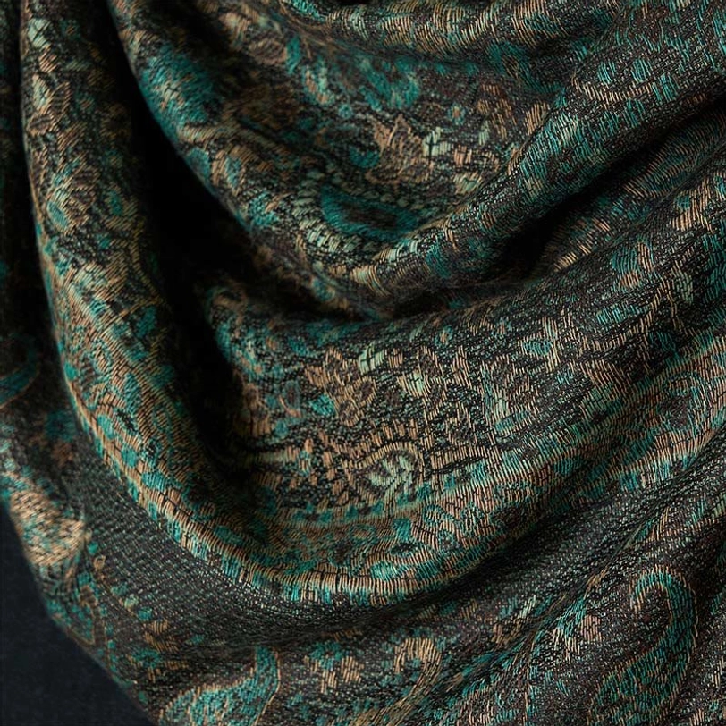 Tibetan paisley shawl extreme close-up, soft draped fabric showing detailed woven pattern and craftsmanship