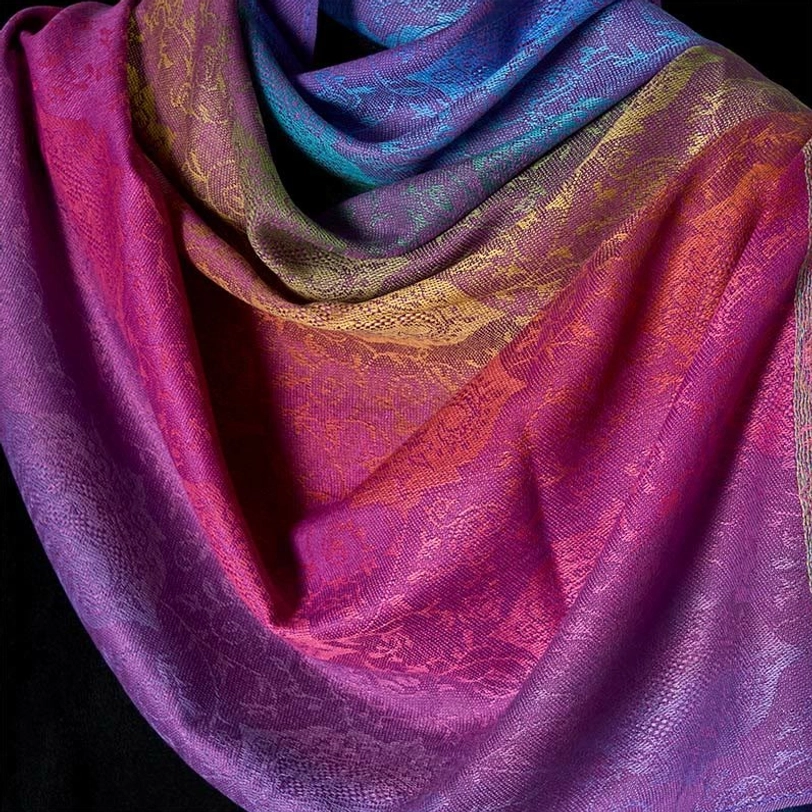 Close-up ultra detail of Tibetan paisley gradient shawl fabric - rich color transition and intricate woven texture