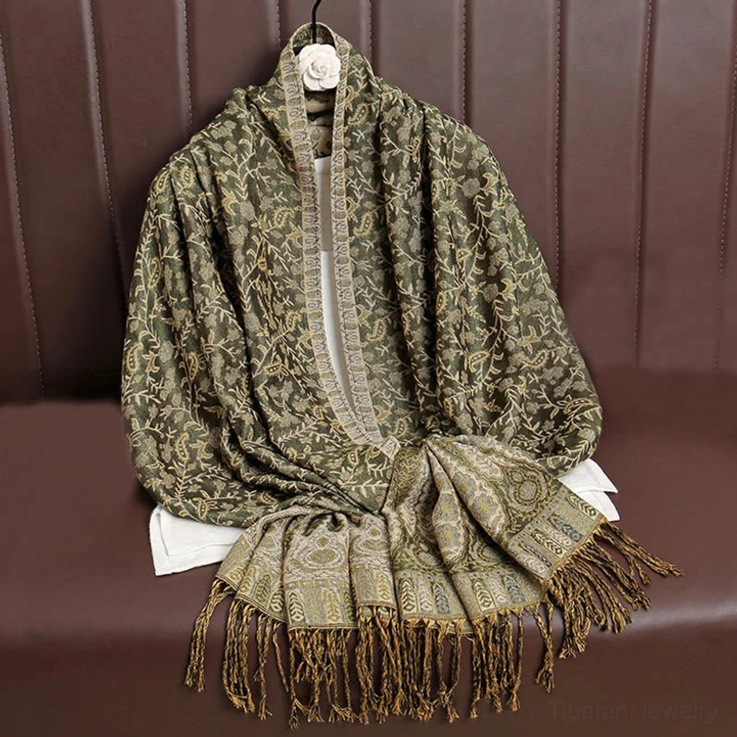 Tibetan paisley tassel shawl displayed flat showing full design pattern and fringe hem, ideal for meditation yoga or spiritual practice
