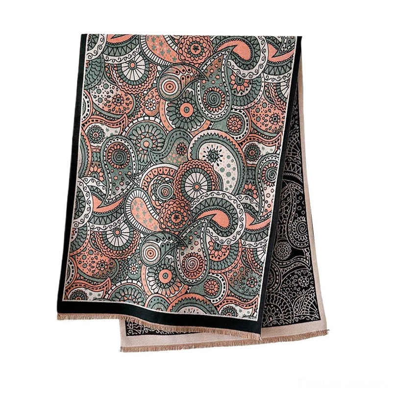 Tibetan ethnic paisley shawl flat lay product shot on white background, displaying classic paisley geometry print and fringed hem