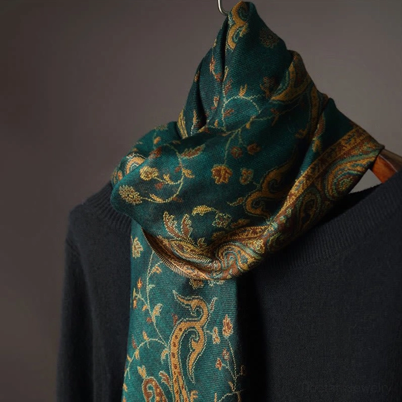 Tibetan paisley shawl folded on mannequin with soft styling showing layered appearance and delicate floral accents