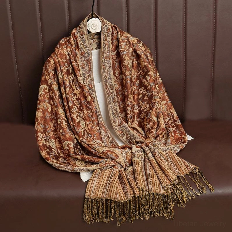 Tibetan ethnic paisley shawl detail showing tassel hem fringe and handcrafted edge quality
