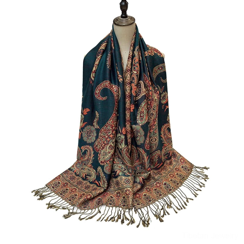 Bohemian paisley shawl fully draped on dress form showing complete styling with teal base and reddish paisley prints