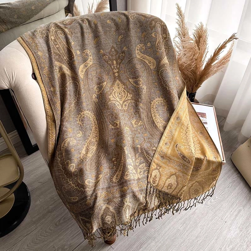 Goldenrod Tibetan paisley tassel shawl on dress form with contrast border detail