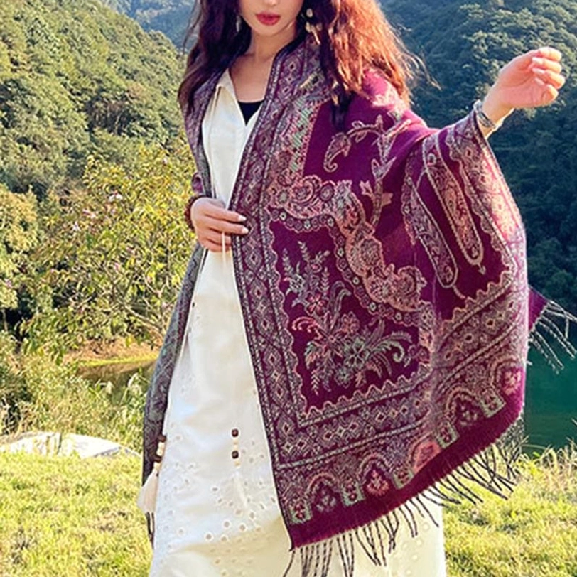 Tibetan jacquard paisley shawl close-up texture showing handcrafted weaving quality and natural fiber composition details