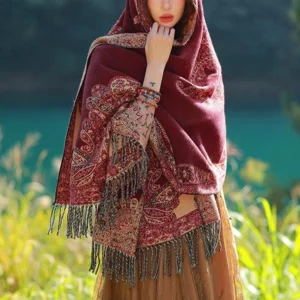 Hooded Tibetan paisley shawl with fringe trim and beaded bracelets detail close-up