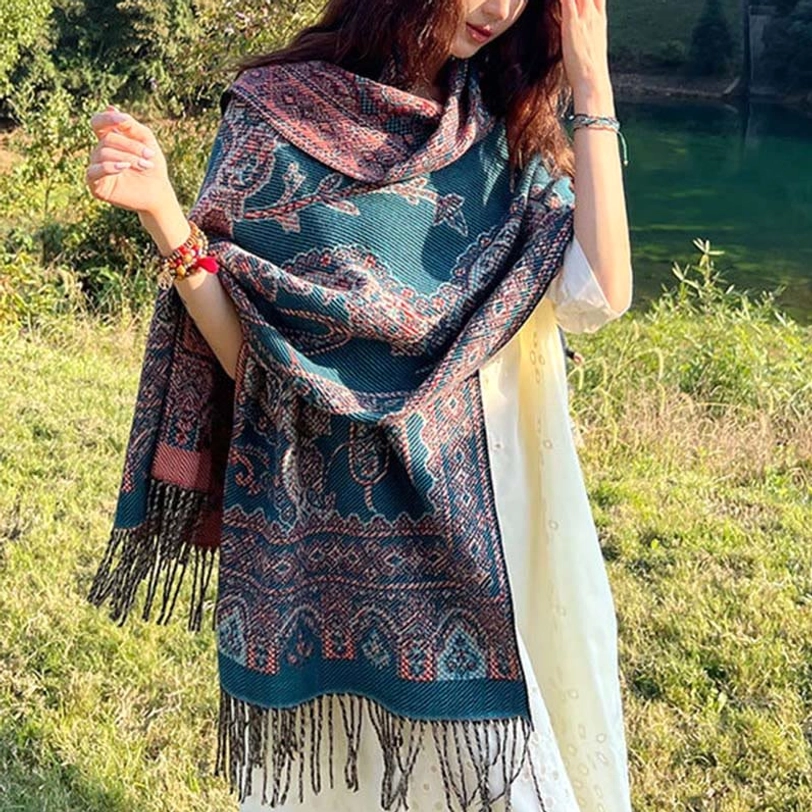 Tibetan jacquard paisley ethnic shawl close-up detail showcasing intricate woven pattern and tassel fringe craftsmanship