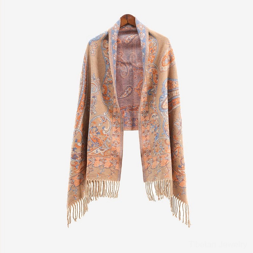Tibetan paisley tassel shawl lifestyle shot showing cultural heritage piece styled in modern home setting