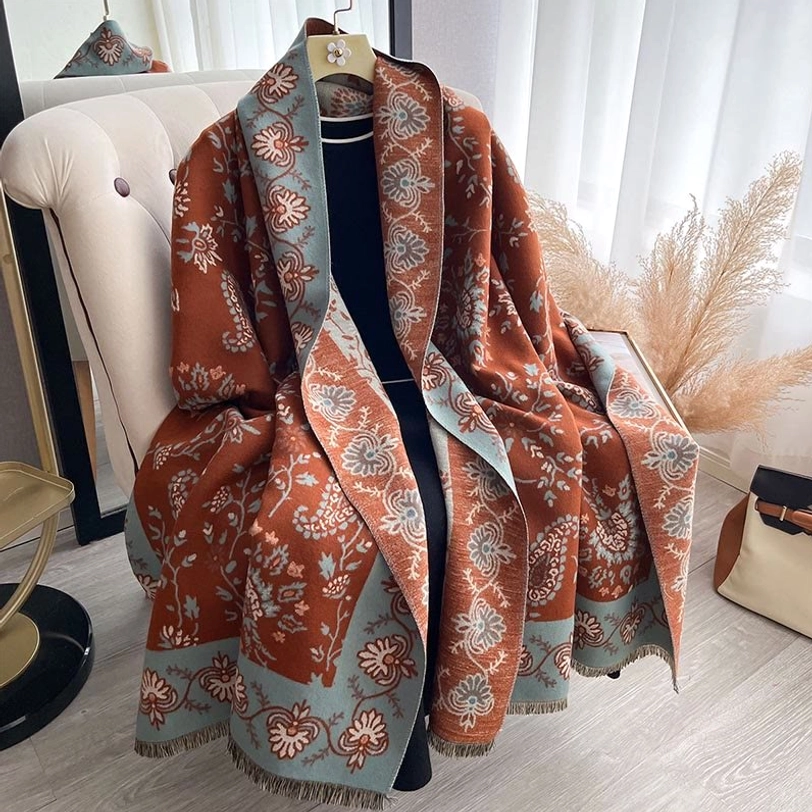Tibetan paisley shawl draped on mannequin showing matching brown and blue floral design
