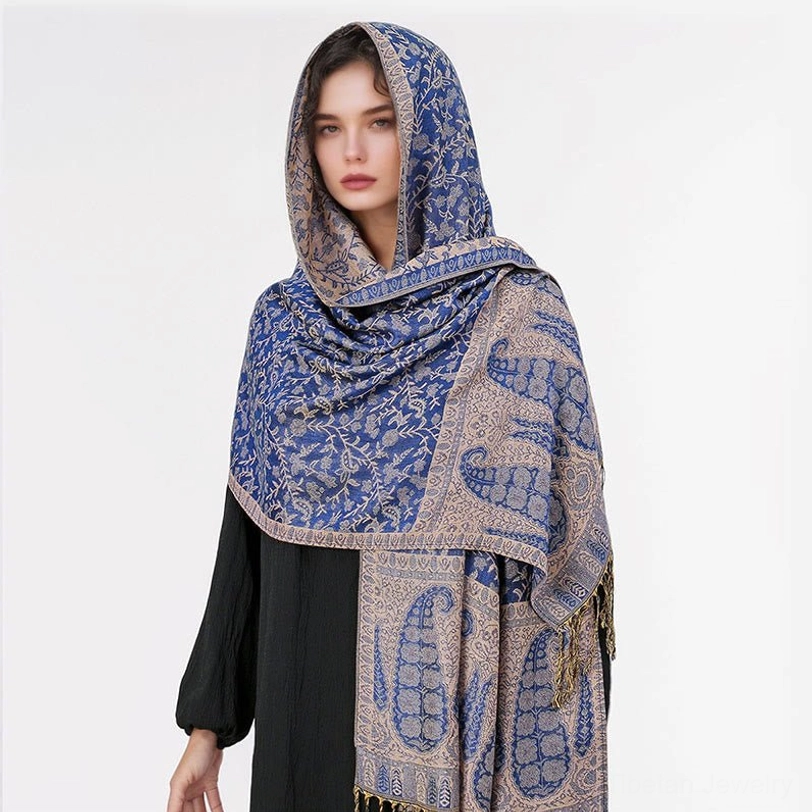 Tibetan jacquard paisley shawl draped elegantly over shoulders demonstrating how to style as evening wrap or casual shoulder shawl
