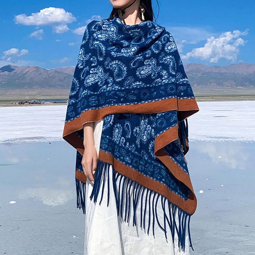 Tibetan navy blue paisley patterned shawl with white motifs and brown border, side front perspective showing tassel hem detail