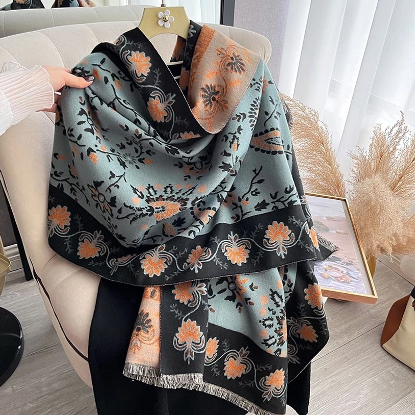 Tibetan paisley shawl wrap displaying soft woven fabric and traditional floral design pattern