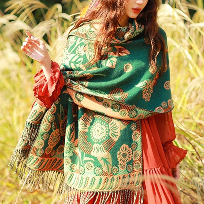 Tibetan paisley tassel shawl worn during spiritual ceremony representing cultural reverence and Buddhist aesthetic principles