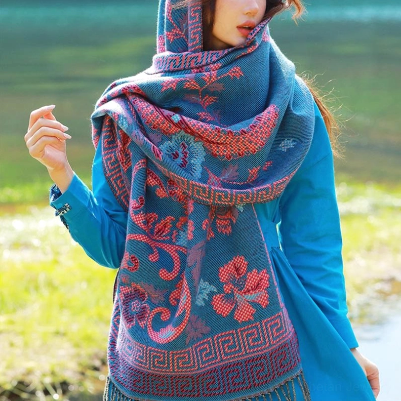 Steel blue Tibetan floral paisley shawl with tassel fringe worn as fashion accessory showcasing contemporary bohemian styling