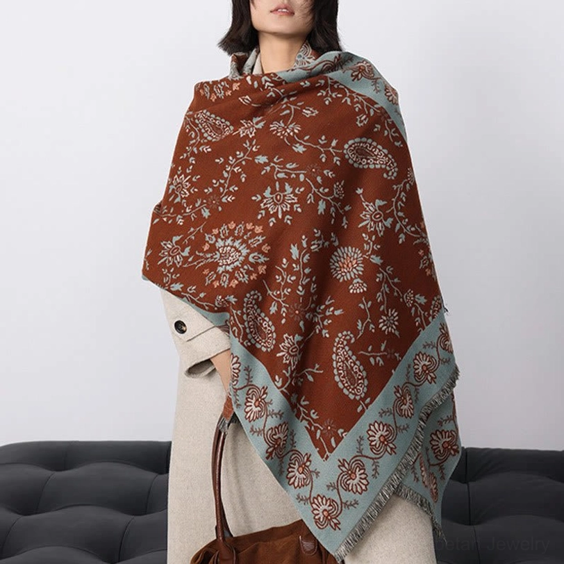 Tibetan paisley winter shawl styled over coat in minimal studio setting with full body view