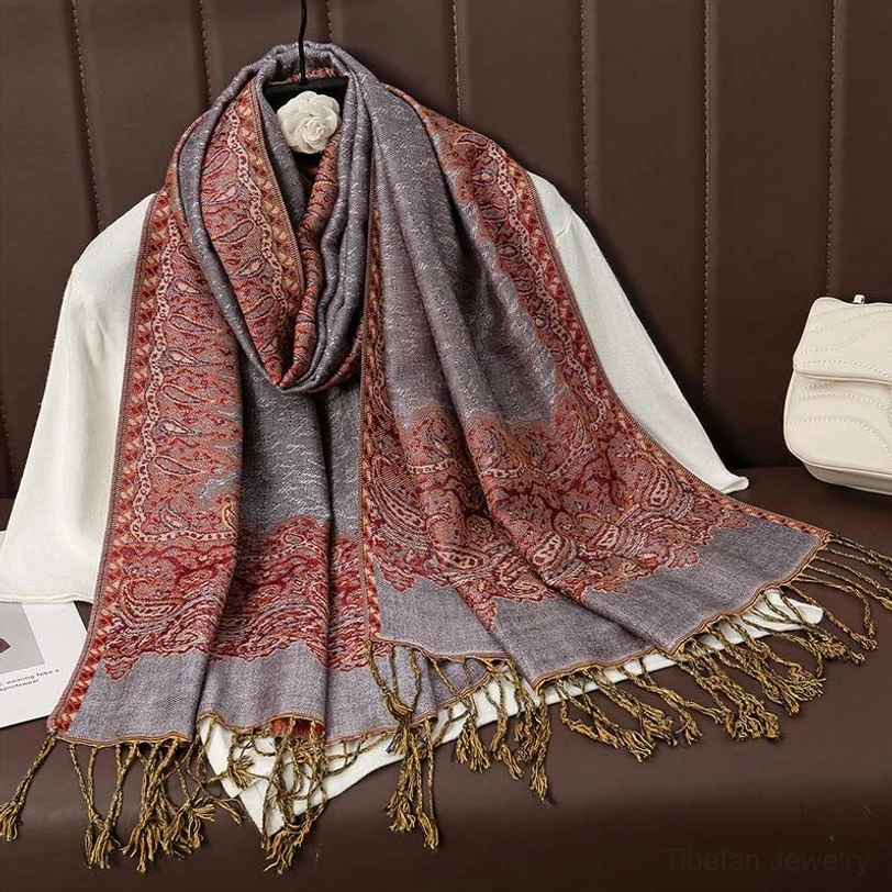 Thistle-toned tibetan paisley jacquard tassel shawl displaying soft purple-grey hue with intricate woven pattern